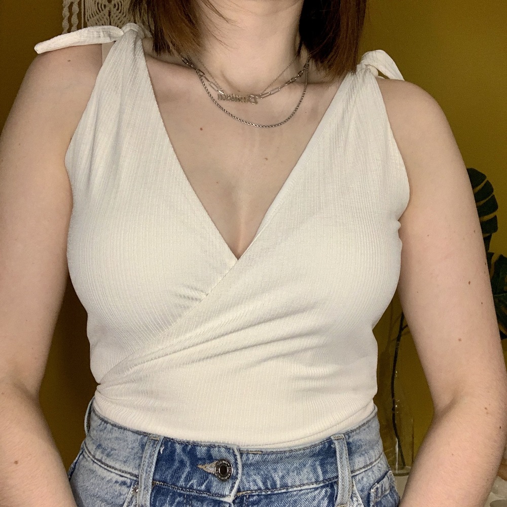 WHITE V NECK BODYSUIT WITH KNOTS